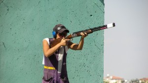 man taking a shot using his rifle